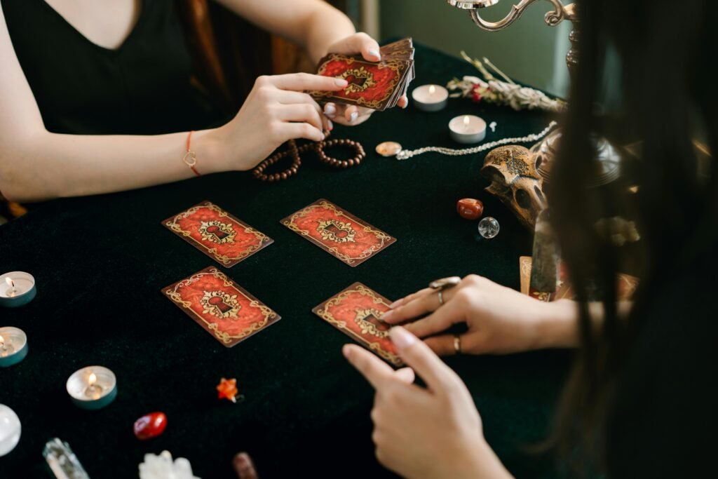 pexels-photo-6944184-6944184 A tarot card reading session with crystals and candles, creating a mystical atmosphere.